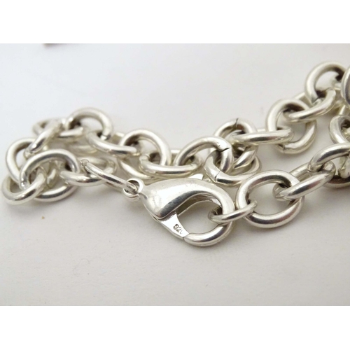 713 - A quantity of assorted silver and white metal jewellery to include bracelets, pendant, ring, etc.