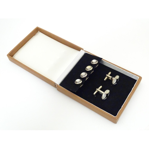 751 - Cufflinks and studs with mother of pearl and enamel decoration.