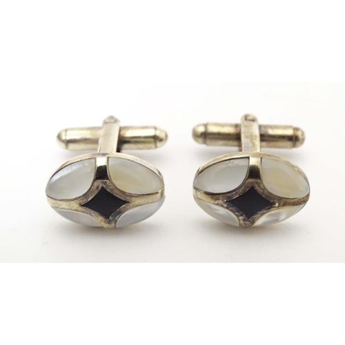 751 - Cufflinks and studs with mother of pearl and enamel decoration.