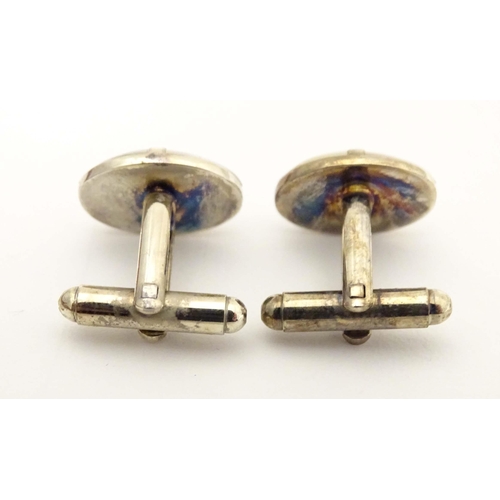 751 - Cufflinks and studs with mother of pearl and enamel decoration.