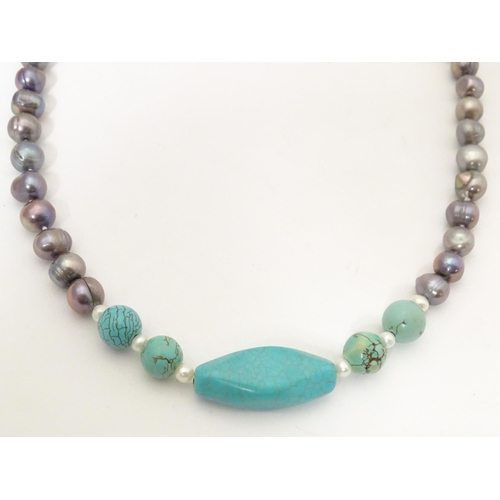 752 - Two necklaces, one set with pearl and turquoise beads. The longest approx. 56