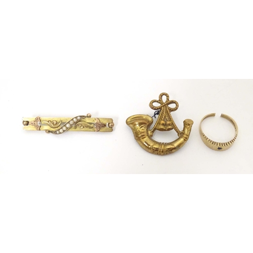 754 - Three items to include a 9ct gold bar brooch set with seed pearl detail, etc. (3)