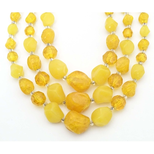 756 - Assorted vintage bead necklaces, to include some amber examples. (5)