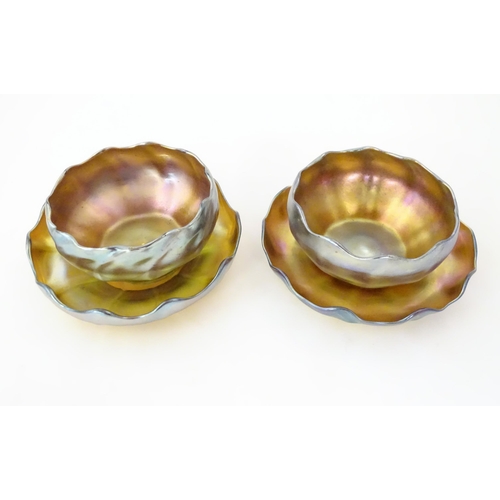 1000 - Tiffany Glass : Two Louis Comfort Tiffany Favrile glass finger bowls and stands. Signed under 'L.C.T... 