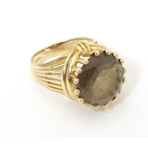 559 - A 14ct gold dress ring set with citrine. Ring size approx K 1/2