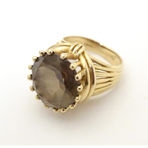 559 - A 14ct gold dress ring set with citrine. Ring size approx K 1/2