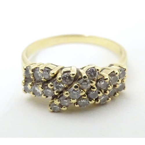 566 - An 18ct gold dress ring set with 21 diamonds. Ring size approx P