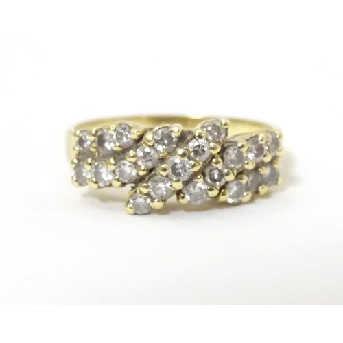 566 - An 18ct gold dress ring set with 21 diamonds. Ring size approx P