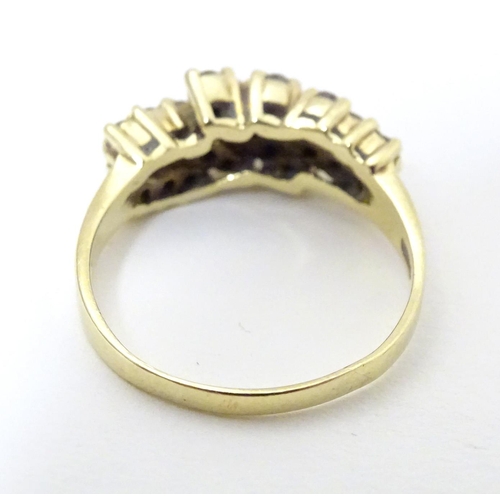 566 - An 18ct gold dress ring set with 21 diamonds. Ring size approx P