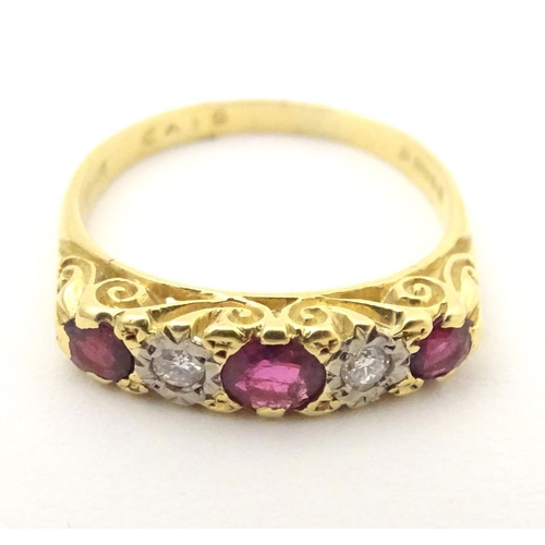 570 - An 18ct gold ring set with diamonds and rubies in a linear setting. Ring size approx. U 1/2