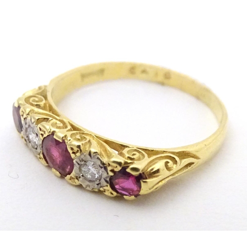 570 - An 18ct gold ring set with diamonds and rubies in a linear setting. Ring size approx. U 1/2