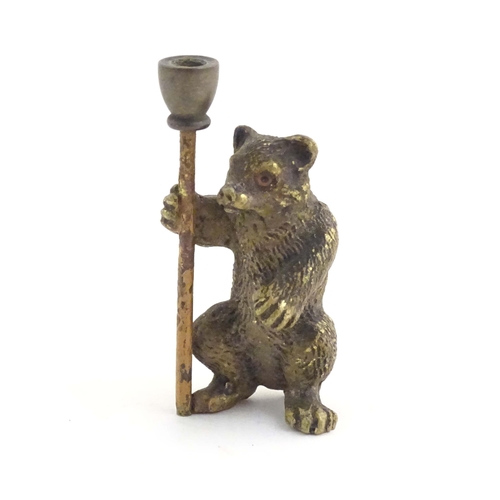 1013 - A novelty cold painted bronze model of a bear with a staff. Approx. 1 3/4