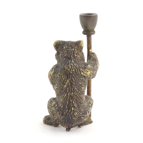 1013 - A novelty cold painted bronze model of a bear with a staff. Approx. 1 3/4