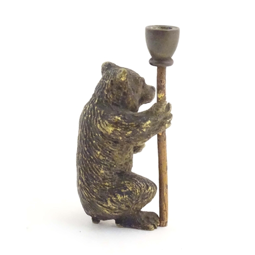 1013 - A novelty cold painted bronze model of a bear with a staff. Approx. 1 3/4