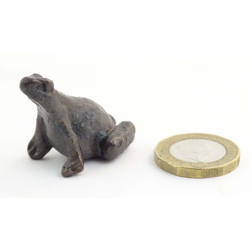 1014 - A cold painted bronze model of a seated frog. Approx. 1 1/4