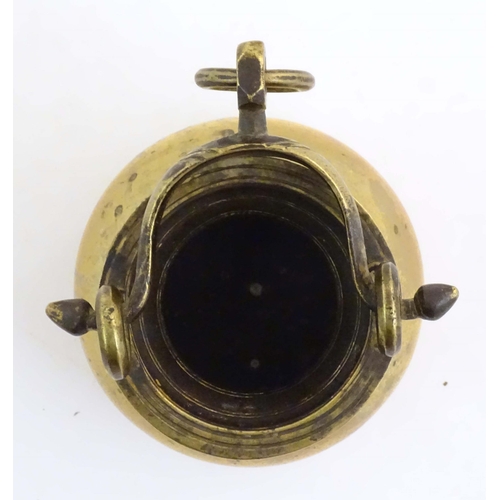 1023 - A brass water pot with bulbous body and swing handle with hanging loop and incised banded decoration... 