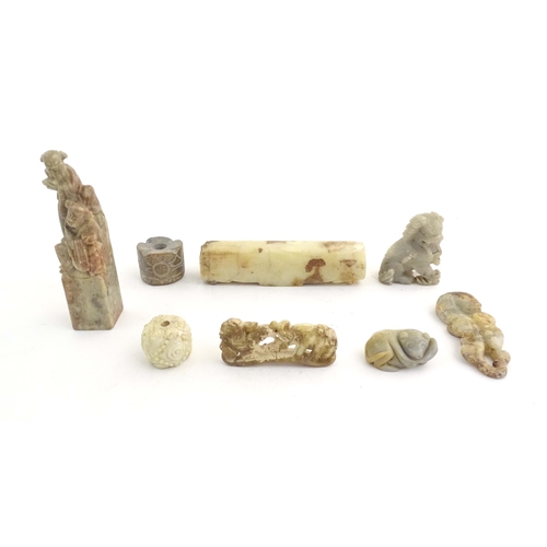 1036 - A quantity of assorted Oriental carved soapstone items to include a hand seal surmounted by two figu... 