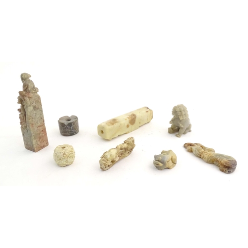 1036 - A quantity of assorted Oriental carved soapstone items to include a hand seal surmounted by two figu... 