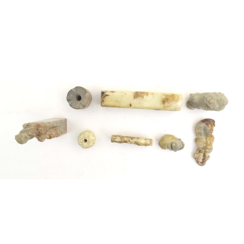 1036 - A quantity of assorted Oriental carved soapstone items to include a hand seal surmounted by two figu... 