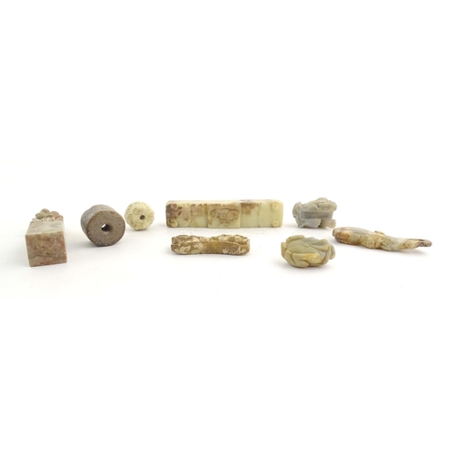 1036 - A quantity of assorted Oriental carved soapstone items to include a hand seal surmounted by two figu... 