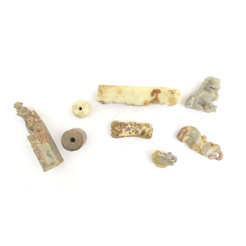 1036 - A quantity of assorted Oriental carved soapstone items to include a hand seal surmounted by two figu... 