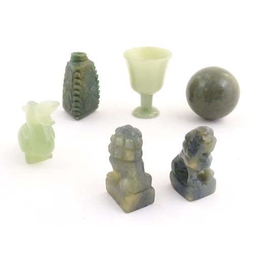 1042 - A quantity of Oriental jade coloured hardstone carvings to include two miniature foo dogs, a miniatu... 