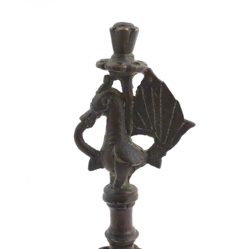 1050 - An Indian / Deccan cast temple style oil lamp with turned column surmounted by a Hamsa bird. Approx.... 