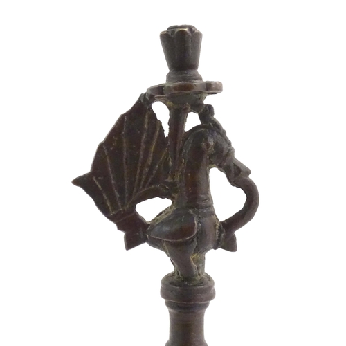 1050 - An Indian / Deccan cast temple style oil lamp with turned column surmounted by a Hamsa bird. Approx.... 