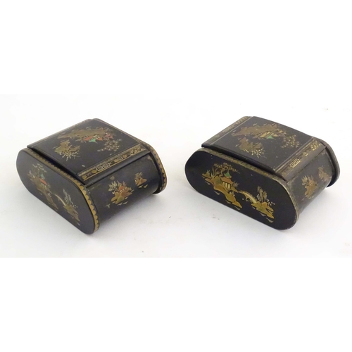 1059 - Two 20thC lacquered boxes with hinged lids decorated with chinoiserie decoration with pagodas in lan... 