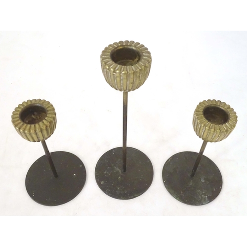 1259 - Three mid century modernist candlesticks, the reeded brass sconces on a cylindrical stem on a circul... 