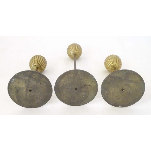 1259 - Three mid century modernist candlesticks, the reeded brass sconces on a cylindrical stem on a circul... 