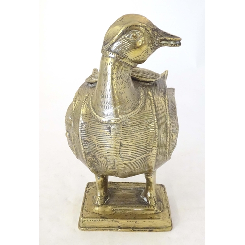 1261 - A late 19th / early 20thC Indian brass container modelled as a stylised duck with engraved decoratio... 