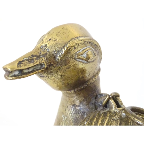 1261 - A late 19th / early 20thC Indian brass container modelled as a stylised duck with engraved decoratio... 