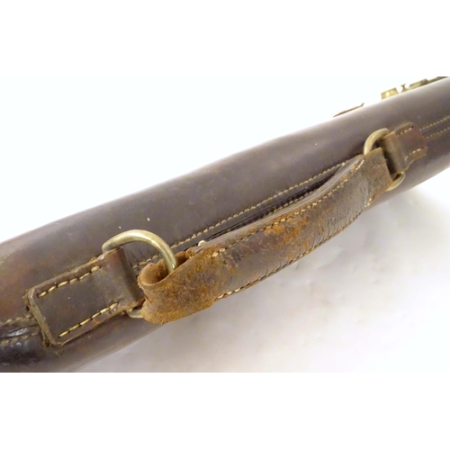 1262 - A late Victorian 'Leg o' Mutton' gun case, of leather construction, the interior with central divisi... 