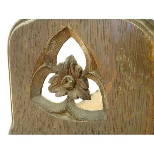 1264 - A 19thC carved oak Gothic book trough with lancet shaped uprights and carved foliate detail. Label u... 