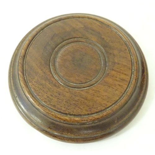 1265 - An early 20thC turned mahogany treen box and cover / container of cylindrical form with banded decor... 