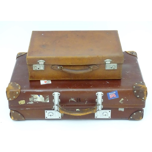 1267 - A mid 20thC 'Revelation' suitcase, with affixed transit labels, together with a small leather suitca... 