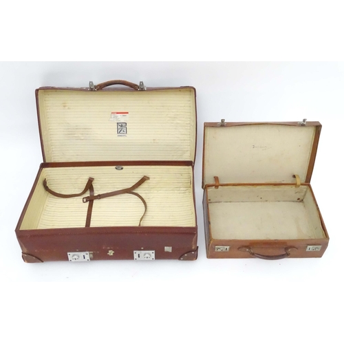 1267 - A mid 20thC 'Revelation' suitcase, with affixed transit labels, together with a small leather suitca... 