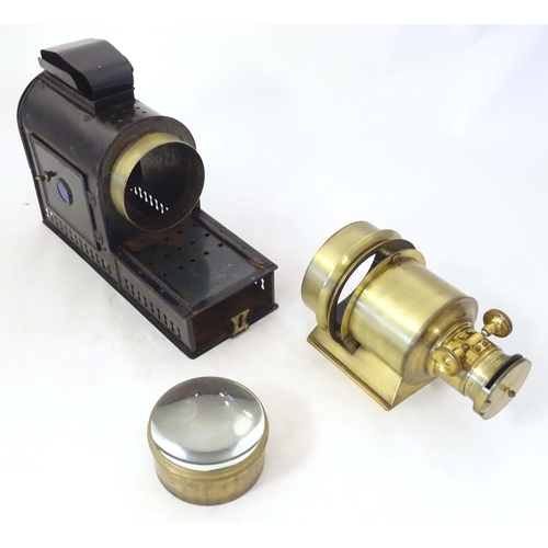 1269 - A late 19th / early 20thC magic lantern slide projector, of tin construction with brass lens section... 