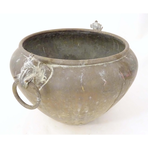 1270 - An Indian brass jardiniere / planter with two stylised elephant mask loop handles. Approx. 11 1/4