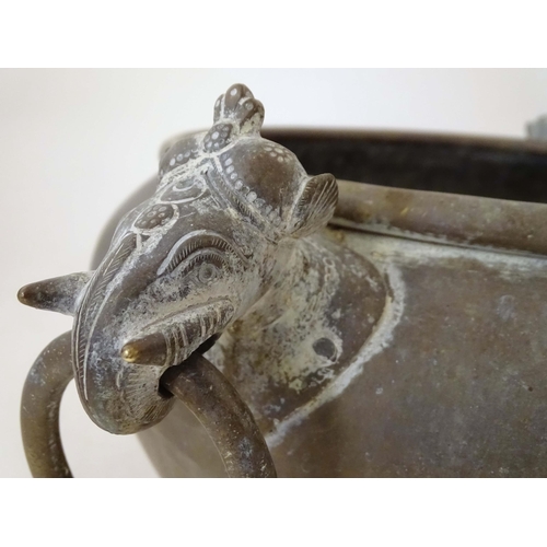 1270 - An Indian brass jardiniere / planter with two stylised elephant mask loop handles. Approx. 11 1/4