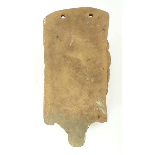 1280 - A terracotta wall bracket / pocket with Classical male figure mask detail. Approx. 19