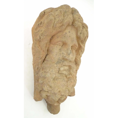 1280 - A terracotta wall bracket / pocket with Classical male figure mask detail. Approx. 19