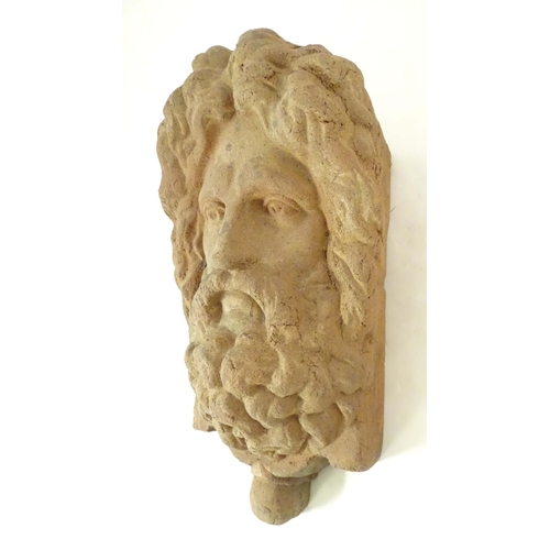 1280 - A terracotta wall bracket / pocket with Classical male figure mask detail. Approx. 19