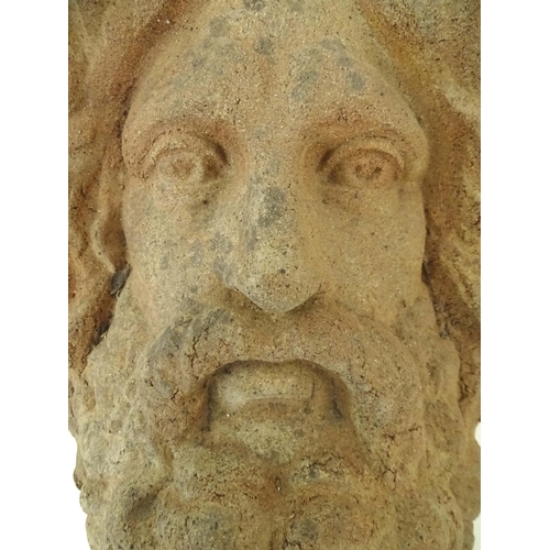 1280 - A terracotta wall bracket / pocket with Classical male figure mask detail. Approx. 19