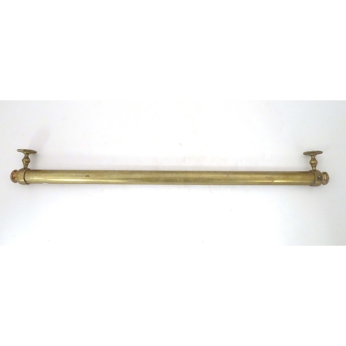 1289 - A Victorian brass towel rail, with wall mounts, 33 3/4