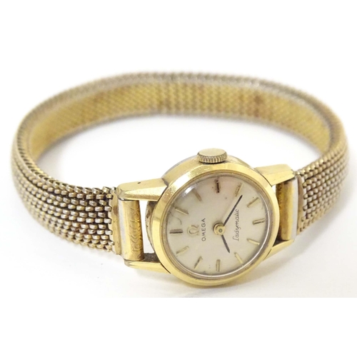 765 - A mid 20thC Omega 'Ladymatic' wrist watch, together with a ladies' 9ct gold cased wrist watch by Maj... 