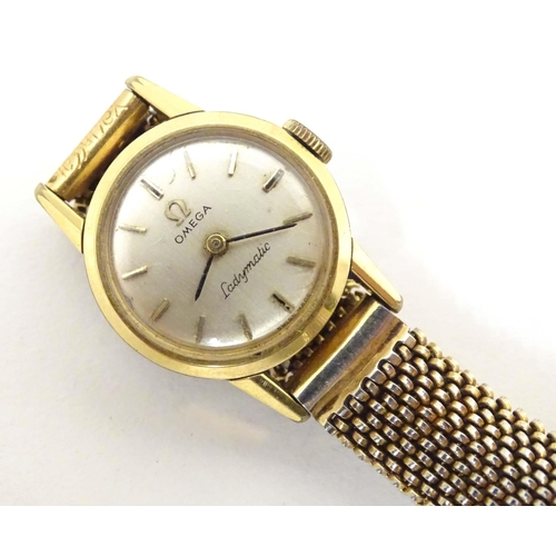 765 - A mid 20thC Omega 'Ladymatic' wrist watch, together with a ladies' 9ct gold cased wrist watch by Maj... 