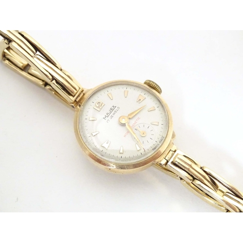 765 - A mid 20thC Omega 'Ladymatic' wrist watch, together with a ladies' 9ct gold cased wrist watch by Maj... 