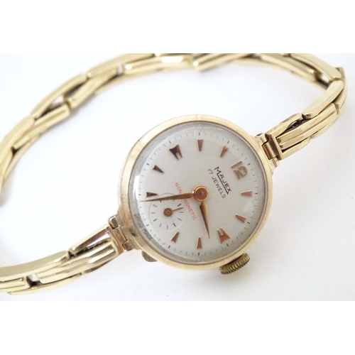 765 - A mid 20thC Omega 'Ladymatic' wrist watch, together with a ladies' 9ct gold cased wrist watch by Maj... 